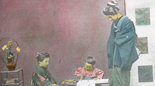 Boy learning to write Japanese circa 1915